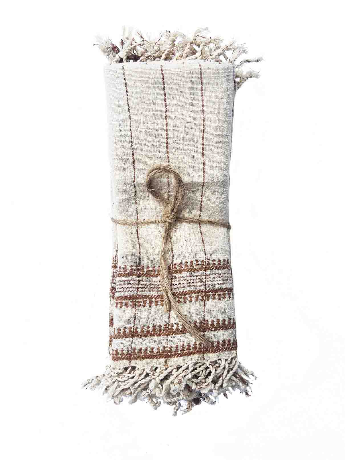 Set of four brown organic Kala cotton table napkins