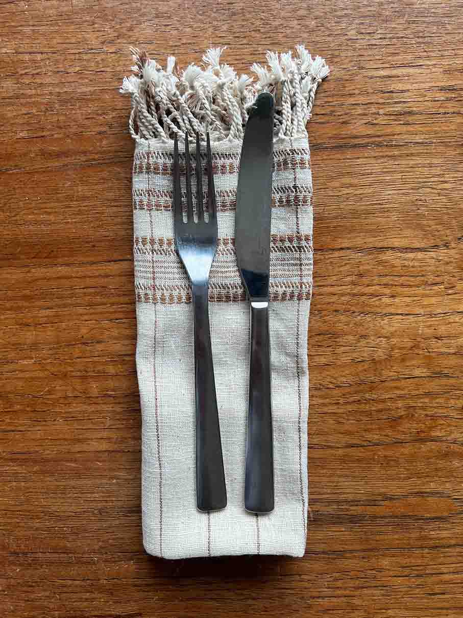 Set of four brown organic Kala cotton table napkins