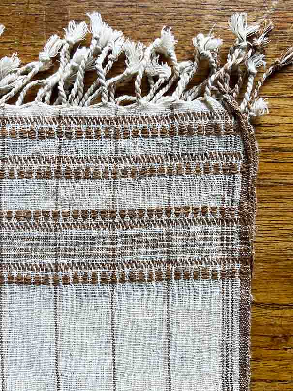 Set of four brown organic Kala cotton table napkins