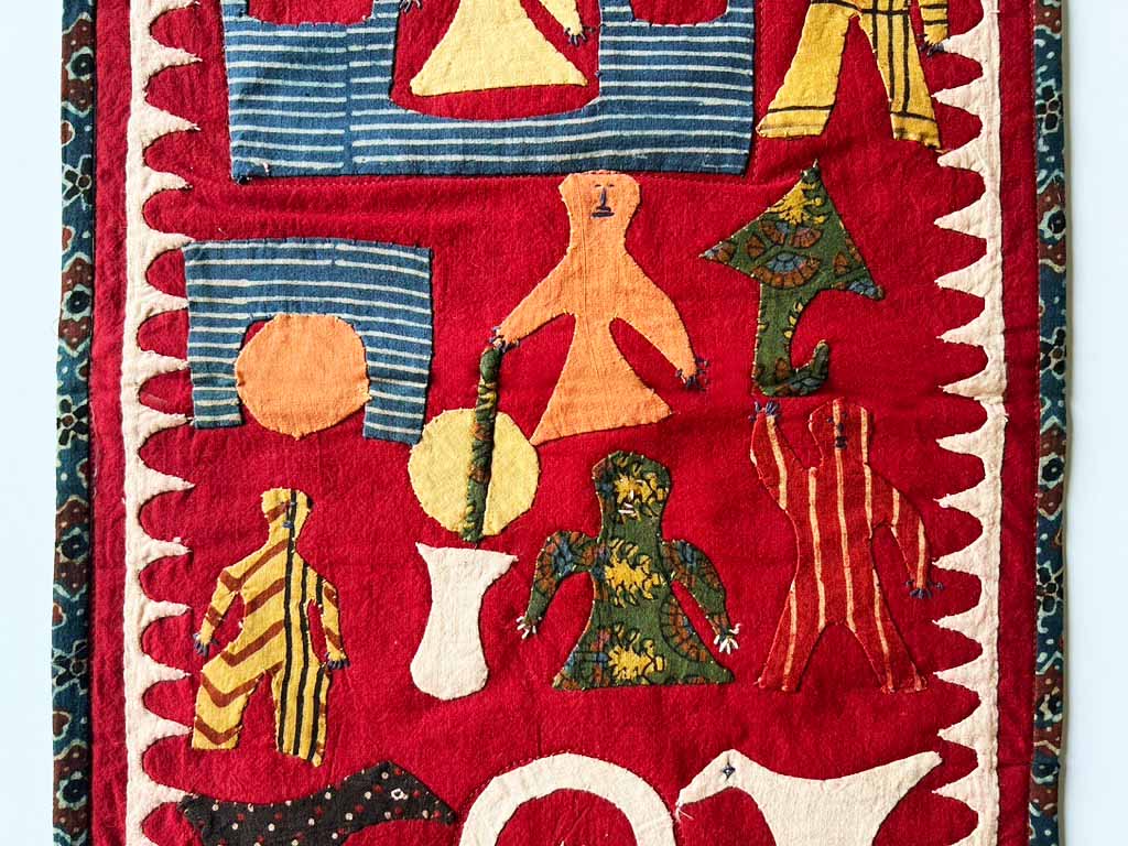 Kids celebrate the coming of the monsoon, red background