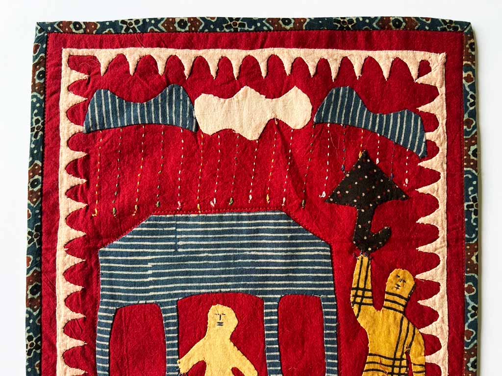 Kids celebrate the coming of the monsoon, red background