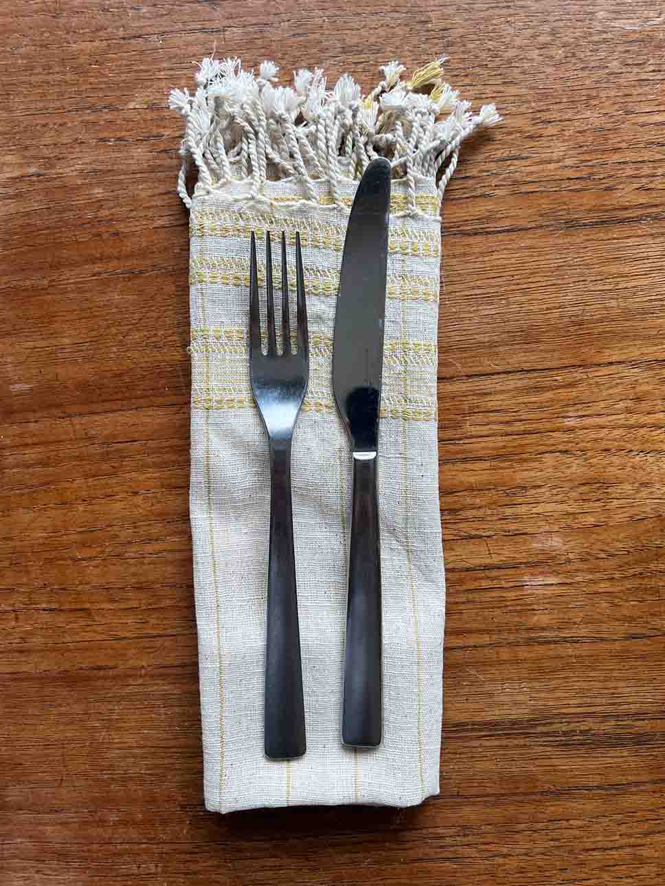 Set of four yellow organic Kala cotton table napkins